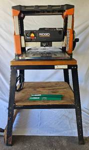 lot 11 image: Ridgid R4330 13 Thickness Planer with Rolling Table