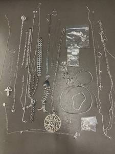 lot 80 image: Assorted Collection of Silver Jewelry Including Necklaces, Bracelets, and Pendants