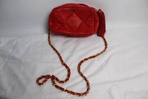 lot 7 image: Bascora Red Quilted Leather Crossbody Bag with Tassel