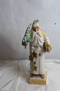 lot 138 image: Vintage Handcrafted Wooden Santa Figurine with Peace Base