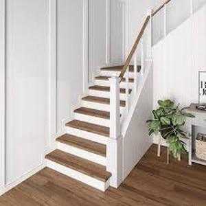 lot 3 image: 8 Boxes of  Cap A Tread Sundance Canyon HickorySmoked Umber Oak 47 in. L x 7.37 in. W x 0.56 in. T Vinyl Stair Reversible Riser Customer Returns See Pictures