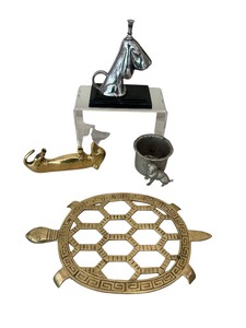 lot 184 image: Mid-Century Dachshund Bottle Opener, Ronson Basset Hound Lighter, Vintage Brass Turtle Trivet Footed Pot Stand Mid Century and More
