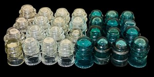 lot 109 image: Large Lot of Clear and Green Vintage Hemingray Glass Insulators