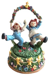lot 53 image: San Francisco Music Box Company  Play Mates Ragged Andy and Ann with Flowers