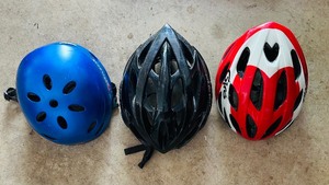 lot 249 image: Three Bicycle Helmets in Various Sizes