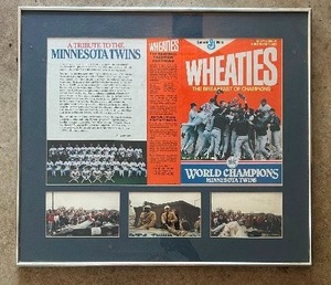 lot 251 image: Framed Minnesota Twins Wheaties Cereal Box from The Twins World Series Championship with Parade Pictures