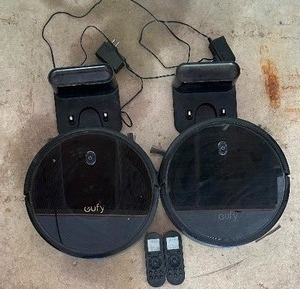 lot 243 image: Pair of Eufy RoboVac Robotic Vacuum Cleaners with Remote Controls