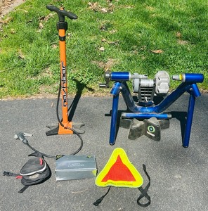 lot 128A image: Bicycle Accessories including Trek CycleOps Indoor Bike Trainer, Tire Pump, Bike Pedals, Reflective Yield Sign and Bike Fanny Pack