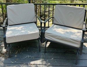 lot 4 image: Pair of Metal Patio Chairs with Tan Cushions and Outdoor Accent Pillows