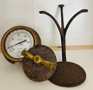 lot 20 image: Vintage Treasures including Freon Suction Pressure Gauge and Antique Horse Carriage Buggy Round Cast Iron Step
