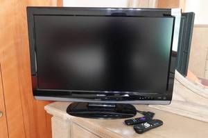 lot 194 image: 32 Sharp TV with Roku Steaming Device