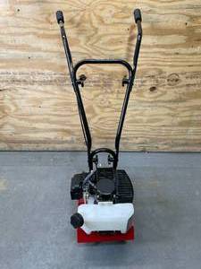 lot 4 image: Toro Cultivator, 43cc 2-Cycle Engine, Adjustable Tilling Width 6-10, Overhand Handlebars, 8 Max Cultivating Depth Model # 58601