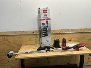 lot 57 image: TORO 60V MAX 14 in. (35.5 cm)  16 in. (40.6 cm) Brushless String Trimmer with 2.5Ah Battery and Charger (Model 51830)