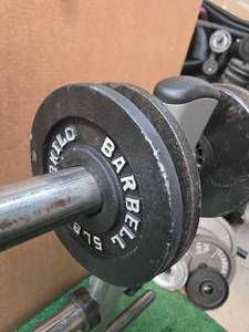 Lot of Four 5LB 2-inch Weight Plates (USED). Storage Rack not included