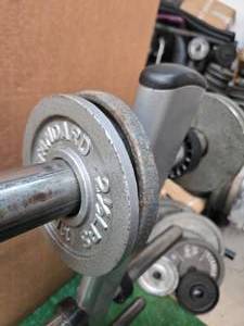 lot 6 image: Lot of Four 2.5LB 2-inch Weight Plates (USED). Storage Rack not included