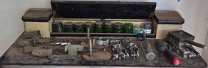 lot 152 image: Collection of Industrial Metal Brackets, Clamps, and Glass Containers