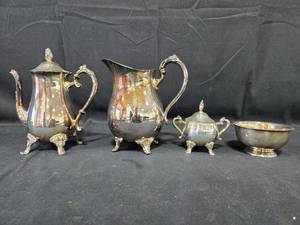 lot 60 image: Oneida Silver Plated Tea Set and Decorative Hair Crown Comb