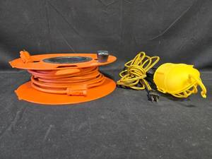 lot 82 image: Portable Hand Lamp with Extension Cord and Reel Set