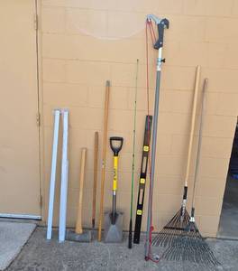 lot 136 image: Collection of Yard and Garden Tools Including Rakes, Shovel, and Pole Pruner