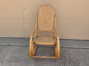lot 176 image: Vintage Rattan Rocking Chair with Curved Design