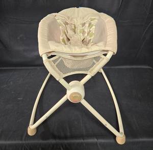 lot 235 image: Fisher-Price Rocking Baby Seat with Leaf Pattern