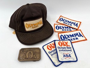lot 89 image: Vintage Olympia Beer Cap, Belt Buckle, and Patch Collection