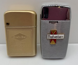 lot 215 image: Grain Belt and Budweiser Vintage Lighter Set