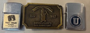 lot 218 image: Collection of 2 Vintage Zippo Lighters and Ambassador Hot Dog Belt Buckle