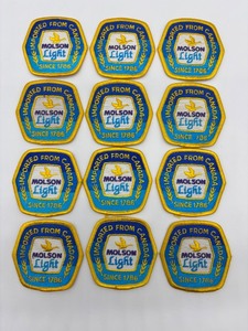 lot 246 image: Set of 12 Molson Light Imported from Canada Embroidered Patches