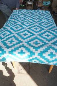 lot 84 image: Outdoor Rug (tealwhite)
