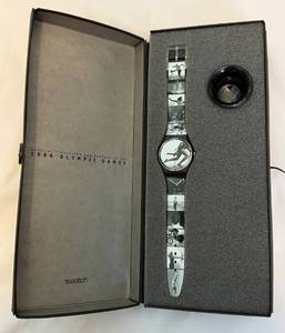 lot 30 image: RARE 1996 Olympic Games Swatch Watch by Annie Leibovitz in Original Box With Papers