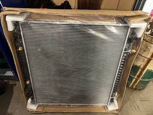 lot 57 image: Heavy-Duty Automotive Radiator in Factory Packaging Fits 99-03 F250, F350, F450, Excursion with 7.3L and 6.8L motor