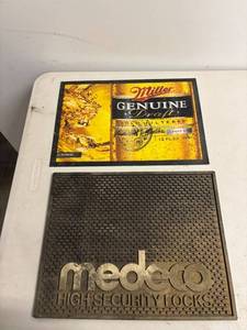 lot 91 image: Miller Genuine Draft Tin Sign and Medeco High Security Locks Plaque