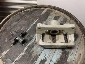 lot 170 image: Automotive Brake Caliper with Additional Component