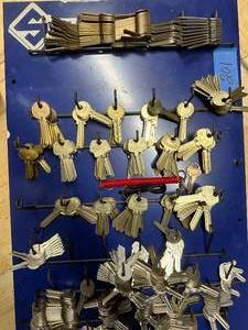 lot 201 image: Assortment of 100 Metal Key Blanks on Display Panel