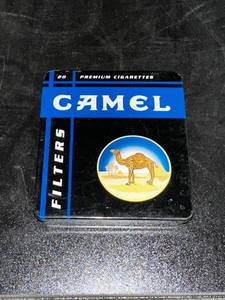lot 177C image: Vintage Camel Cigarette Tin with Zippo Style Lighters and Marilyn Monroe Design
