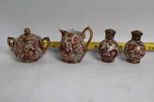 lot 211 image: Japanese Vintage Kutani Moriage Red Gold Porcelain Creamer and Sugar Set with Salt and Pepper Shakers