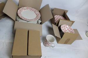 lot 290 image: 16-Piece Red and White Dinnerware Set