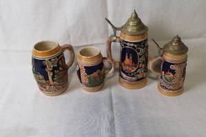 lot A-9 image: Set of 4 German Beer Steins with Relief Decorations