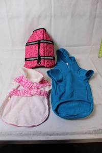 lot 203 image: Collection of Pet Apparel Pink Life Jacket, Blue Hoodie, Pink Fleece Coat