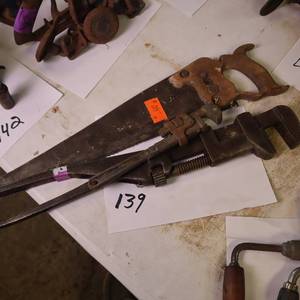 lot 139 image: Vintage pipe wrenches and a quality saw