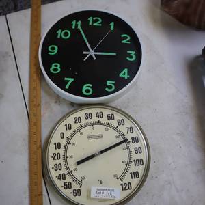 lot 146 image: 2 round things... a clock and a temp gauge.