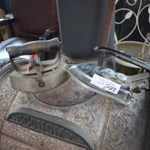 lot 233 image: TWO VINTAGE HOT IRONS