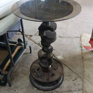 lot 238 image: GLASS TOPPED TABLE  FOR MOTOR MINDED MEN