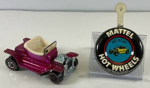 lot 83 image: 1968 REDLINE Hot Wheels Hot Heap Transparent Magenta With Button Very Nice Condition