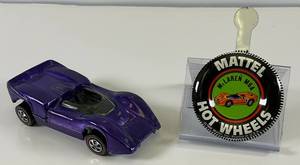 lot 96 image: 1968 REDLINE Hot Wheels Mclaren M6A Transparent Purple With Button Nice Condition