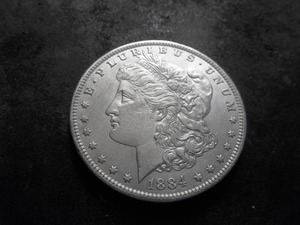 lot 27 image: 1884 O Morgan Silver Dollar