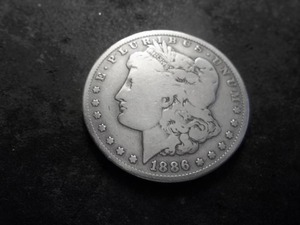 lot 29 image: 1886 O Morgan Silver Dollar