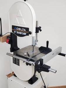lot 36 image: Delta 14 inch Band Saw on a Rolling Base