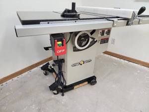 lot 11 image: Awesome Steel City 10 inch Industrial Iron Cabinet Saw on a Rolling Base